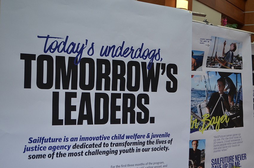 Posters with information about SailFuture lined the main hall of Sarasota Yacht Club