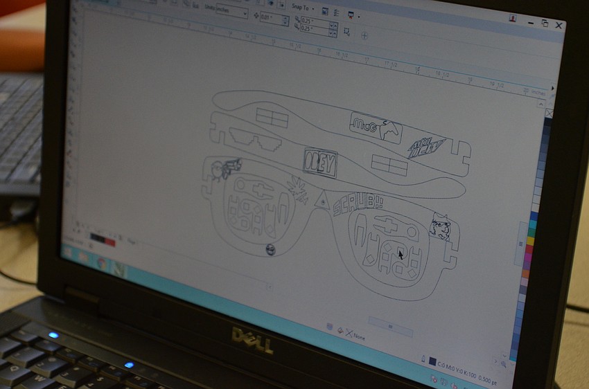 Austin Ingram works on his design using two-dimensional design software called CorelDRAW.