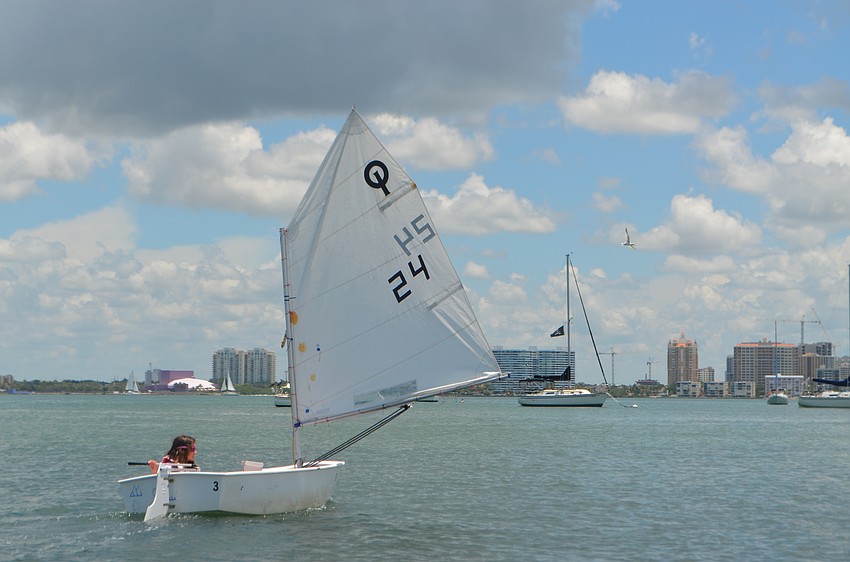 Natalie Norman, 10, steers her boat away from shore.