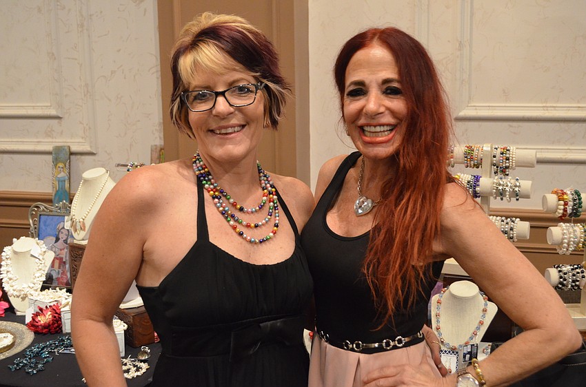 Tonya Smith of Moondance Art — one of several jewelry sellers at the event — and Jill Plotkin.
