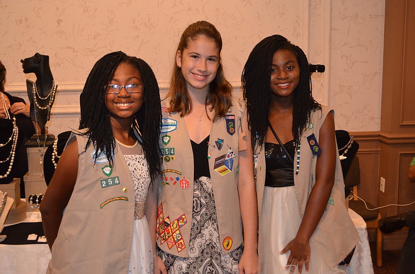 Gabriella Stafford, Faith Holliday and Kaila Stafford, all Girl Scout members of troop 254.