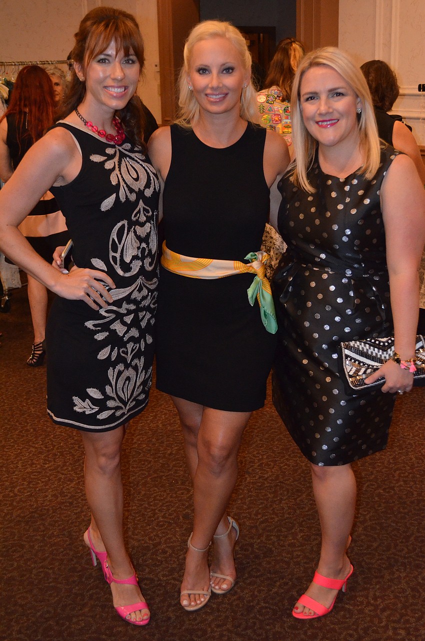 Junior League models Jennie Baumberger and Jeanne Paulus with Junior League member Erin Christy.