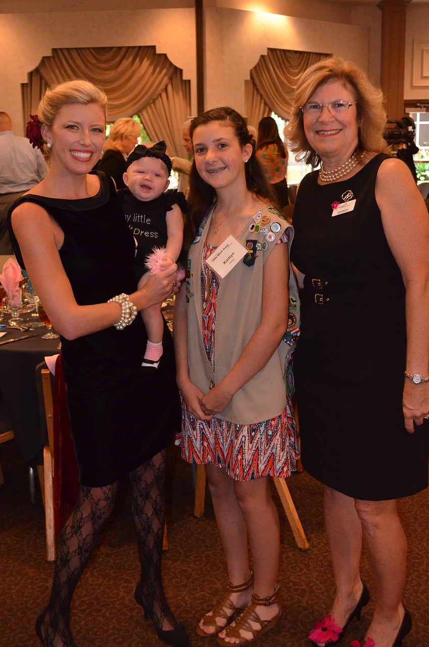 Junior League President Britt Riner and her daughter Magnolia Riner with Girl Scout Kaitlyn Peters and CEO of Girl Scouts of Gulfcoast Florida Sue Stewart.