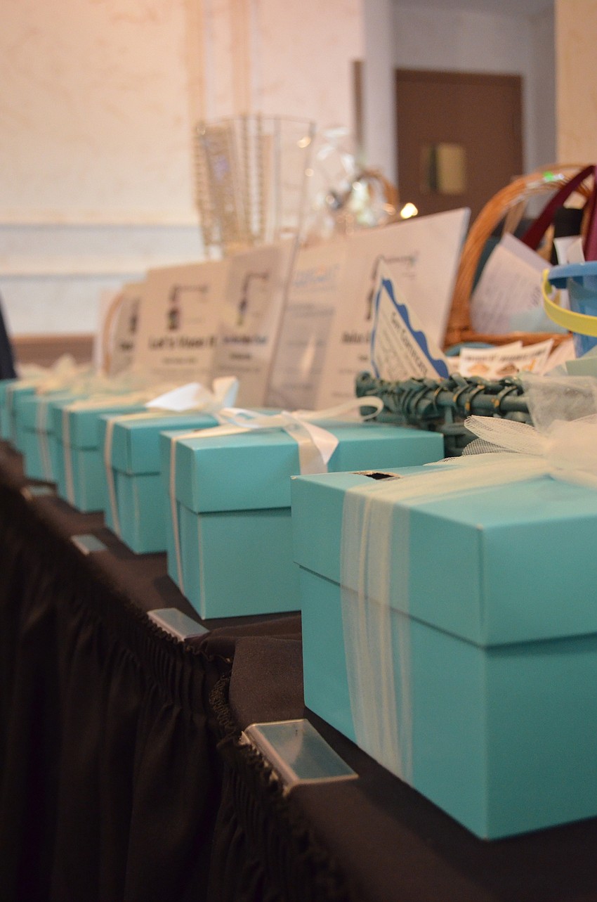 Raffle ticket boxes made to look like jewelry boxes from Tiffany & Co. All the proceeds from the raffle ticket sales benefited both Girl Scouts of Gulfcoast Florida and Goodwill Manasota.