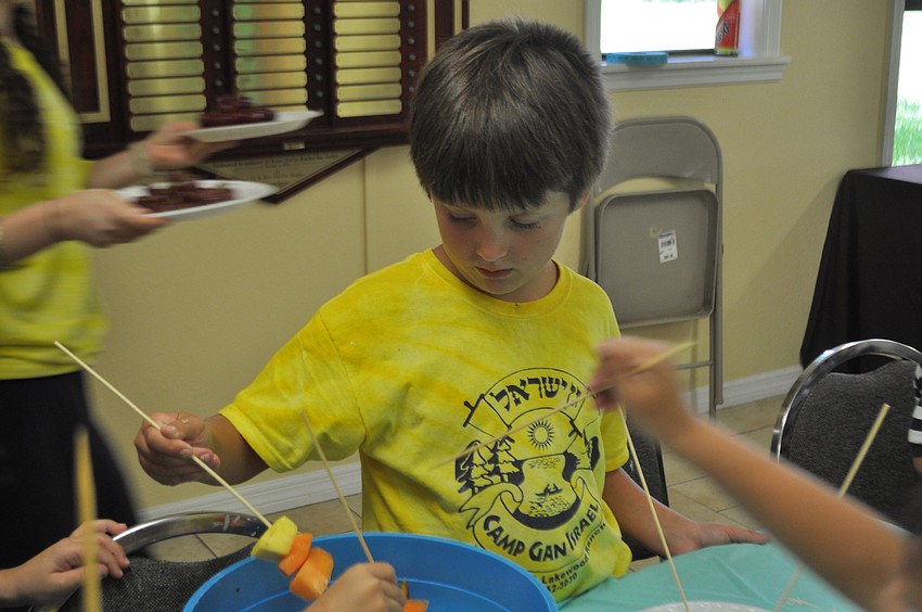 Aaron Kovnot, 8, attends camp while visiting his grandparents, Chabad members Layah and David Shugol.