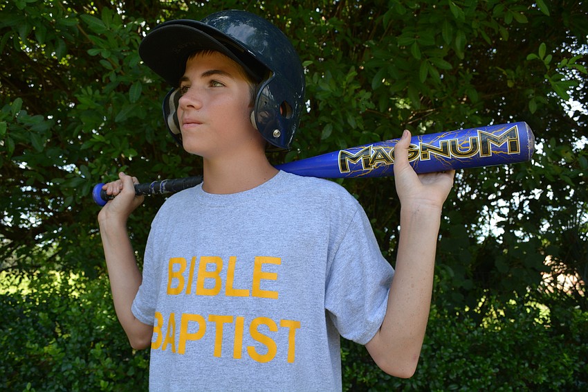 Caleb Bernth, 12, watches his teammates bat as he  stands on deck.