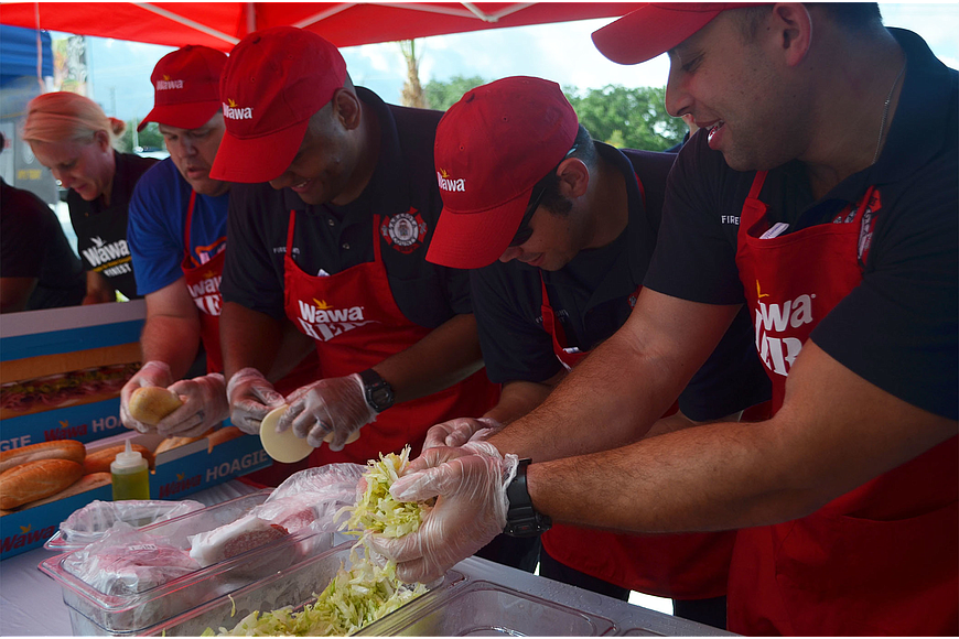 Sarasota firefighters competed against the Sarasota Police Department in a sandwich-making competition outside the Wawa station on North Washington Boulevard Thursday, June 9. The new location is Sarasota's first.