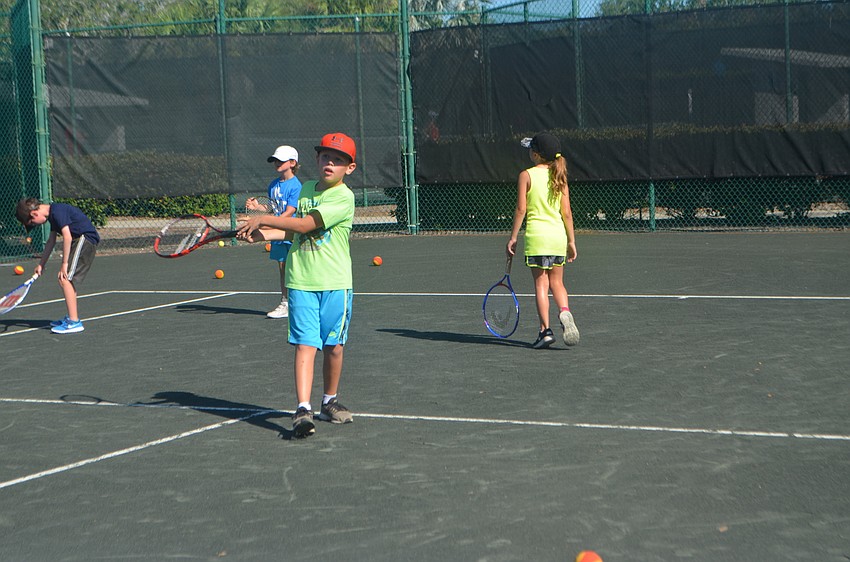 Jackson McLeod, 8, gets ready to swing at the ball.