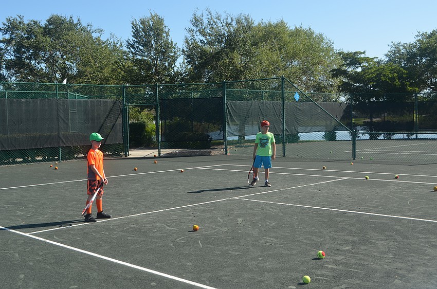 Cort Griffin, 7, and Jackson McLeod, 8, get ready to start a drill.