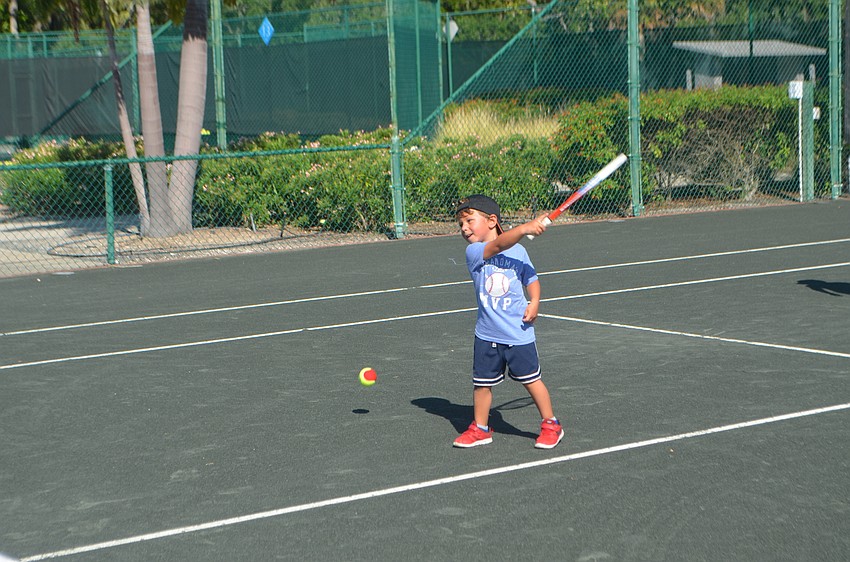 Edward Black, 4, takes a swing.