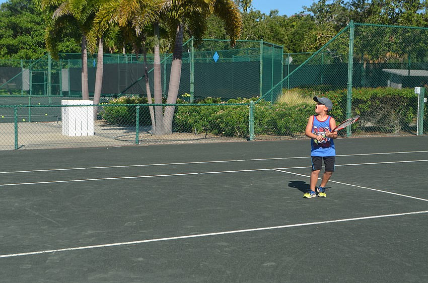 Dylan McLeod, 6, watches the ball after hitting it.
