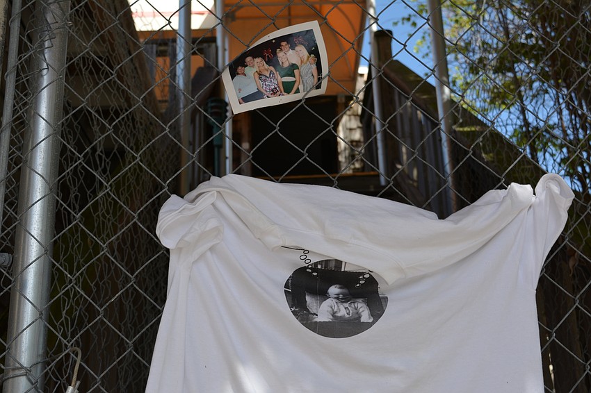 Personal items adorn the entrance to one of the buildings at the former Colony Beach and Tennis Resort.