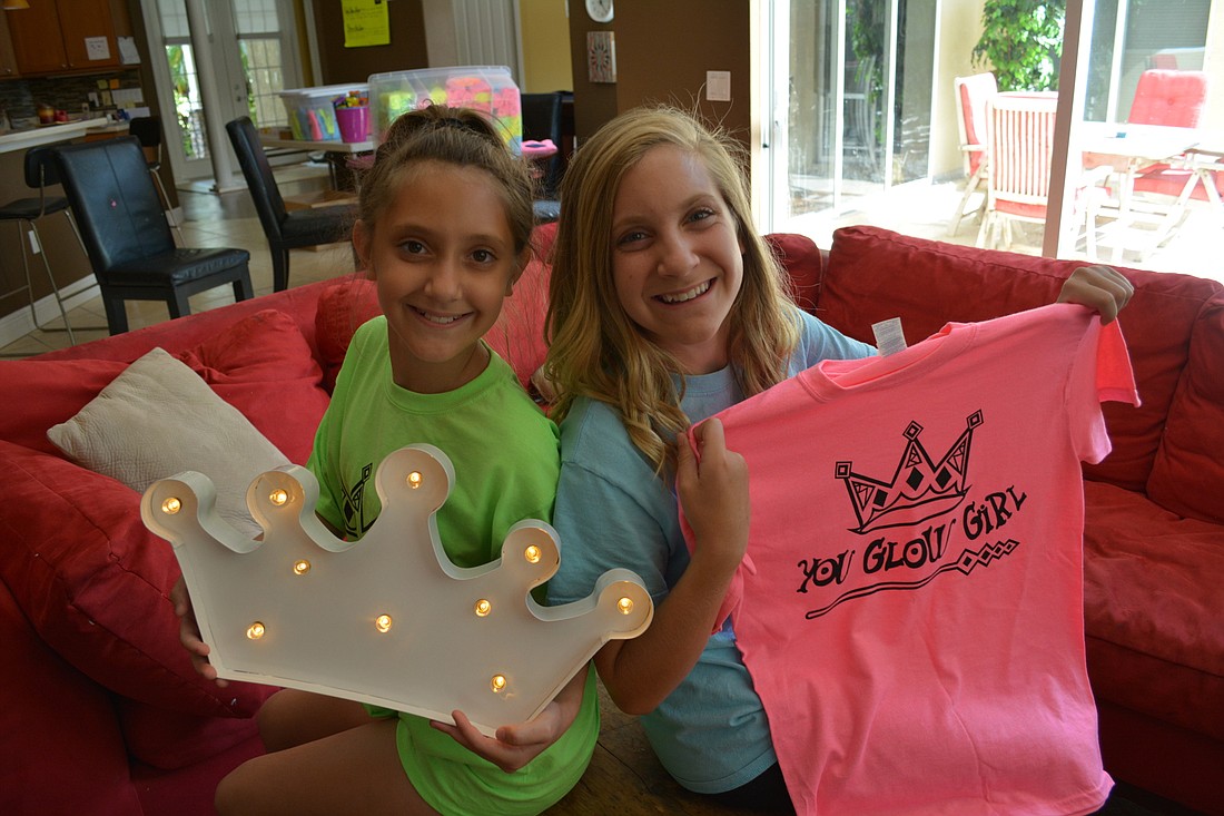 Gabby and Liz Sgro donate $1.40 from every shirt they sell to Girls Inc., because they believe it fits with their mission to empower girls.