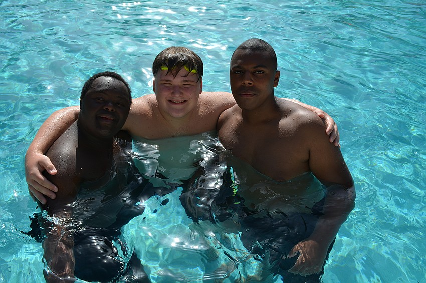 Camper Jake Westermeyer joins counselor and fellow Braden River High student Josh Brunner and camper Brandon Nash.