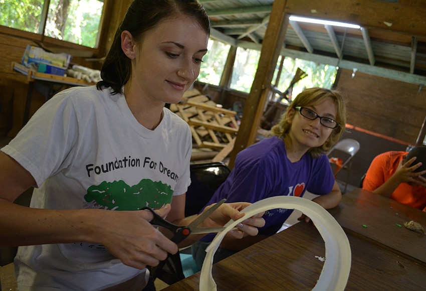 Your Observer | Photo - Maya McCarthy helps camper Tressa Pringle, 14 ...