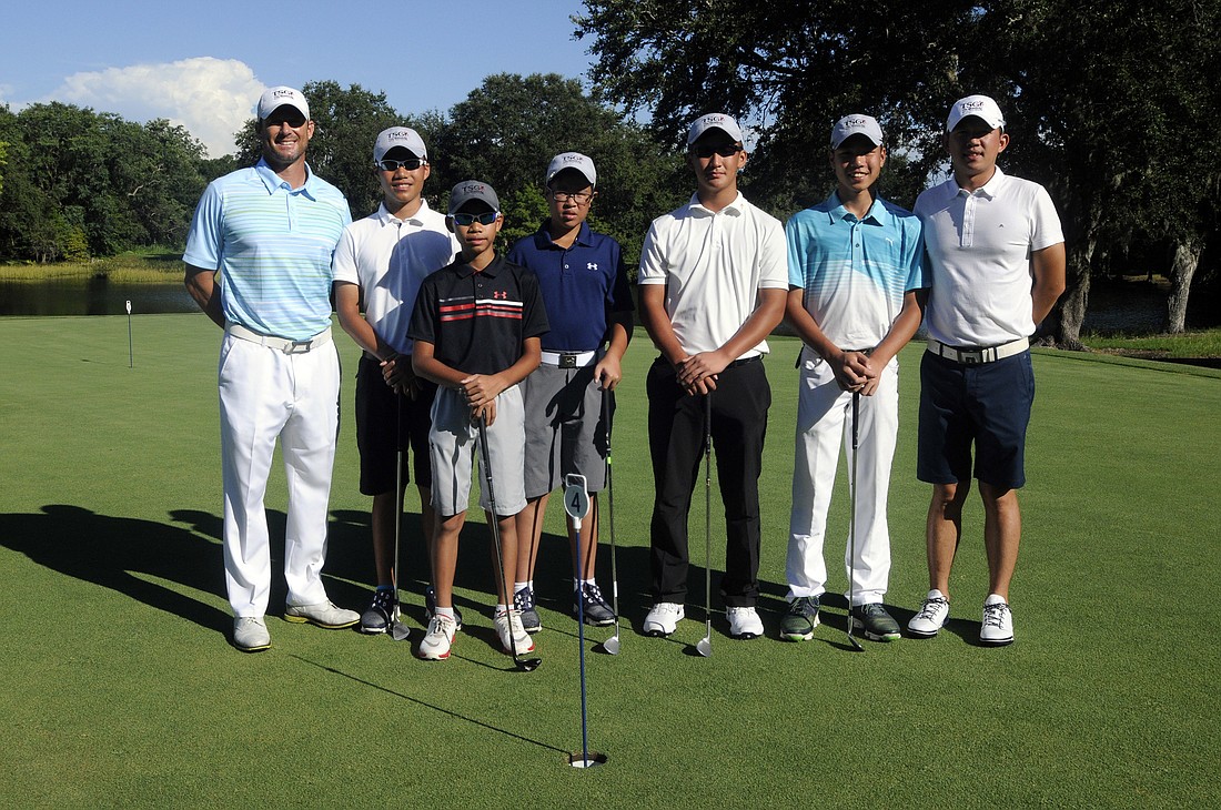 Tim Sheredy spent three weeks coaching Taiwan junior golfers Ting Chen, Yuyu Chen, Alan Kuo, Kevin Shu and Wayne Hsu, pictured with instructor Eric Lo, right, July 11-29, at the River Club Golf Course.