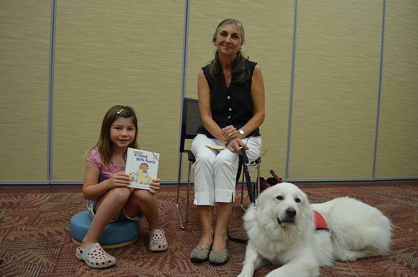 Caiden Grace Sedlak with her book 