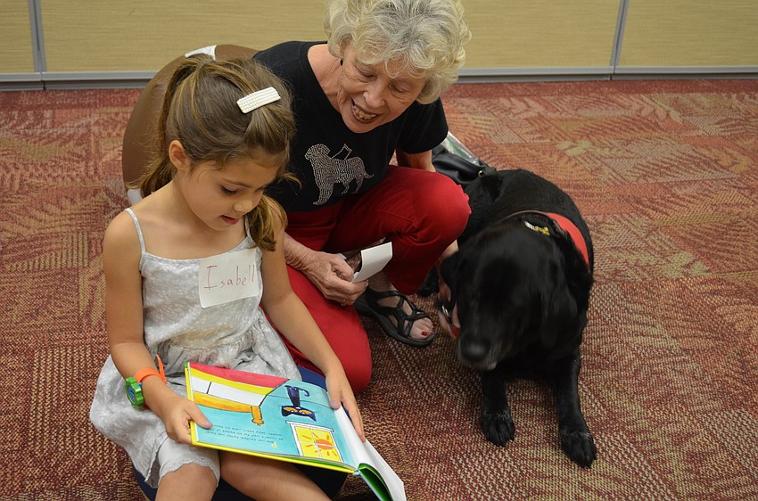 Isabell Georgieva sounds out words to Mary-Lou Moulton and Miss Fay.
