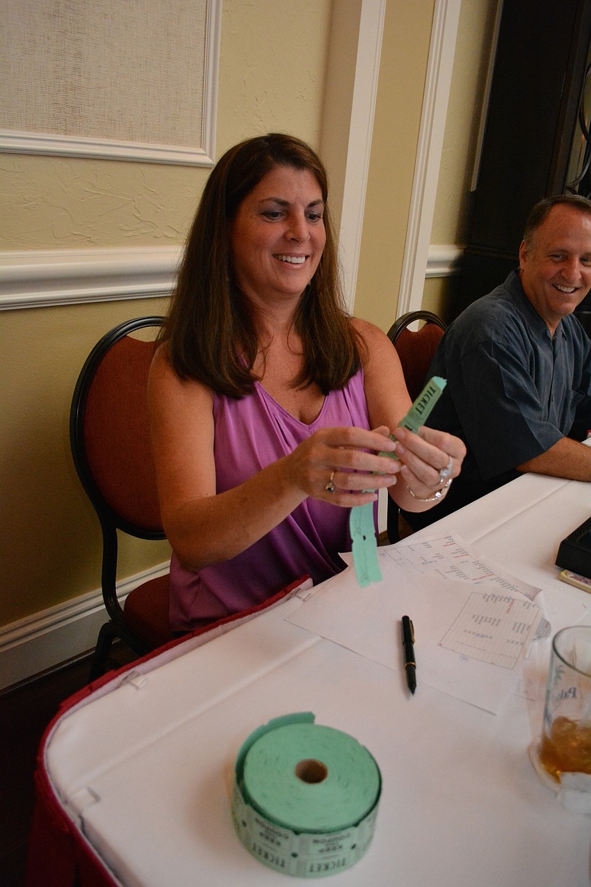 Marci Weibel and her husband, Mark, sell raffle tickets each year.