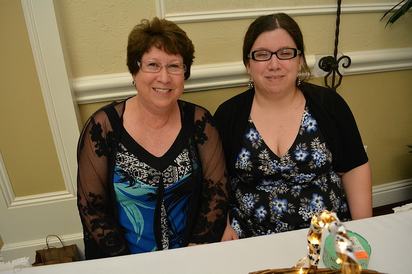 Summerfield's Rossana Schmidt and her daughter, Bryanna, volunteer for the event.