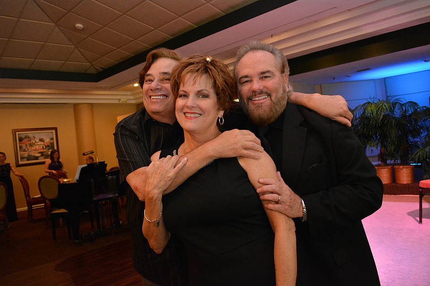Composer Thomas Pasatieri poses with event organizers, opera singers and longtime friends Carol Sparrow and Randolph Locke.