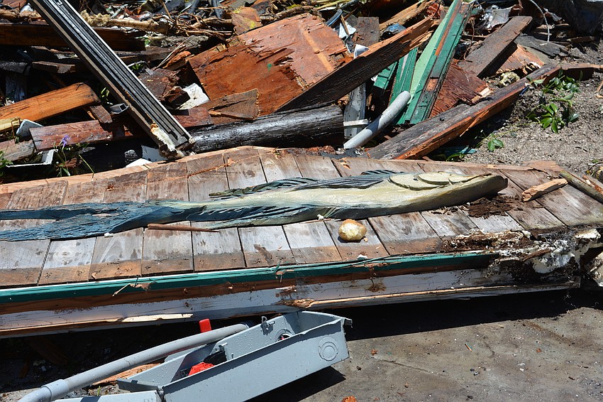 Contractors strive to save some of the Old Florida pieces from the restaurant.