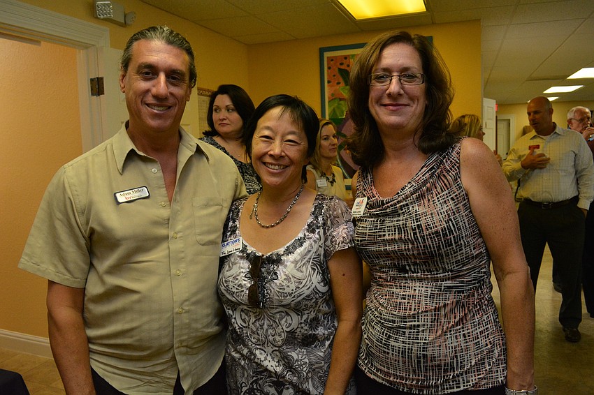 Adam Miller, of Keller Williams, with Fay Lynne Huang, of Clayton's Siesta Grill, and Natalie Lickfield, of One Stop Cooling and Heating.
