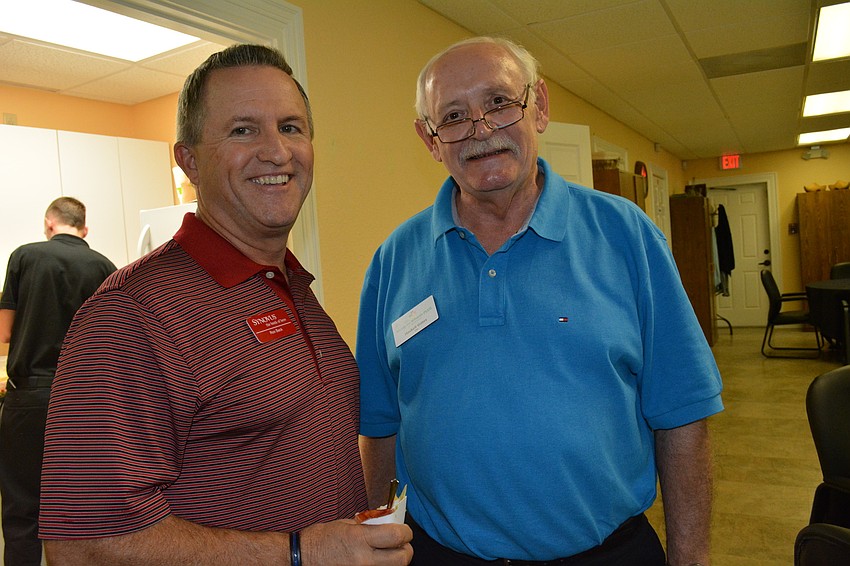 Ron Beck, of Synovus Bank, chats with Haskell Gates, CFO of Meals on Wheels PLUS.