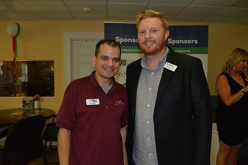 Joe Marra, of Piper Fire Protection, stands with Dawson Hicks, of Sentinel Background Checks.