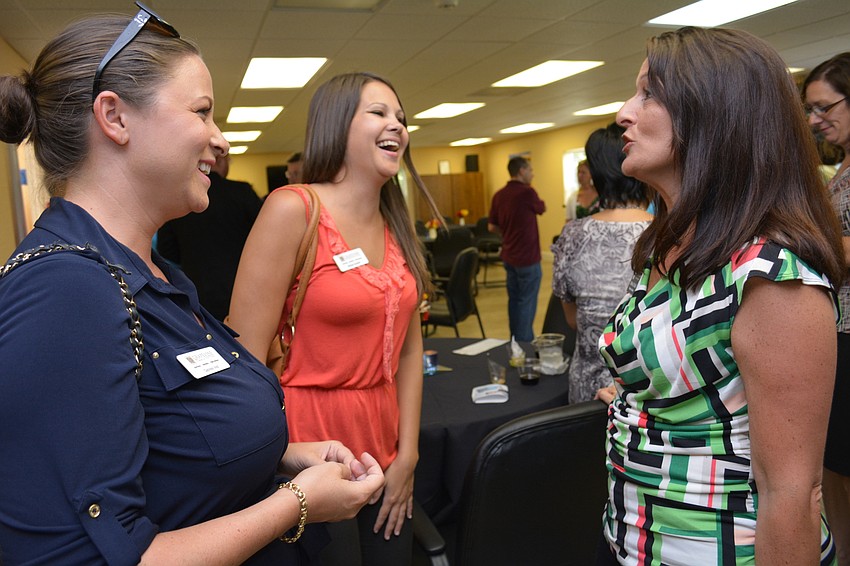 Grapevine Communication's Gabriela Vest and Britney Guerlin converse with Dana Cutallo, of the Boys & Girls Clubs of Manatee.