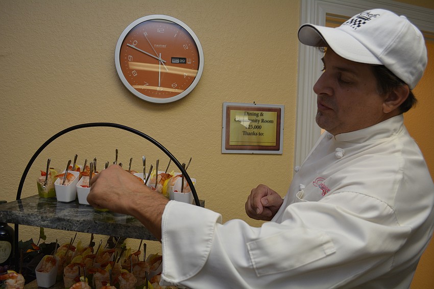 Renaissance on Ninth Executive Chef David Meador tells guests about the dishes he created, including a shrimp and crabmeat Louie salad with guacamole.