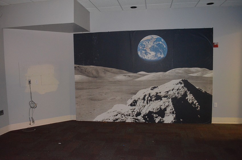 A former theater space can only be lit with a lamp brought into the building after GWIZ vacated the premises.