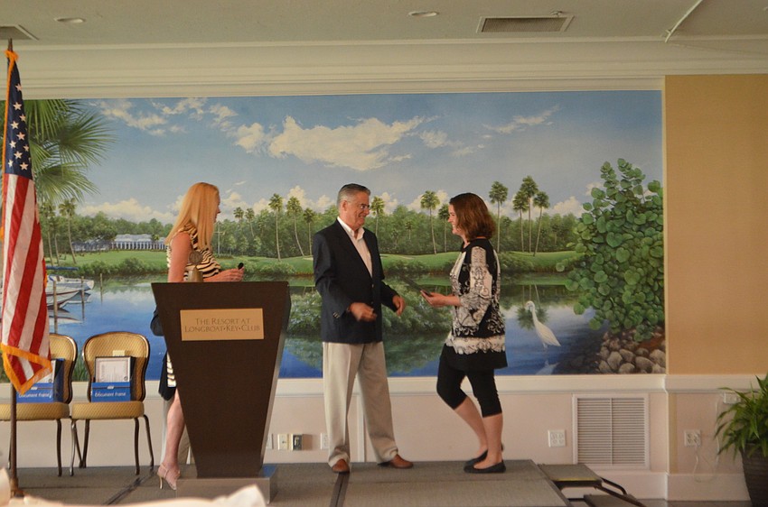 Sierra Blashock walks the stage to accept her academic scholarship from Foundation President Armando Linde.