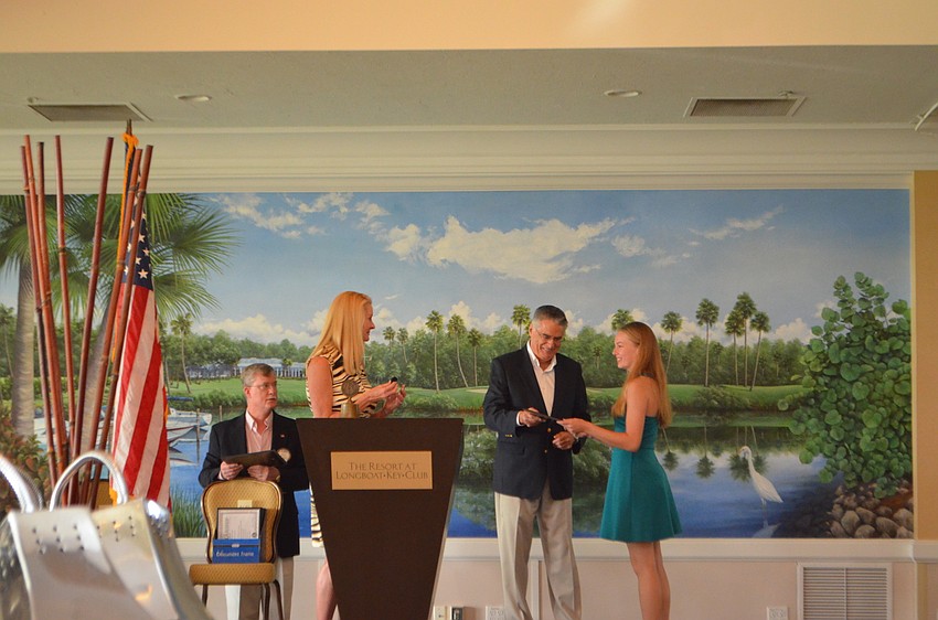 Katelyn Downer accepts her academic scholarship.