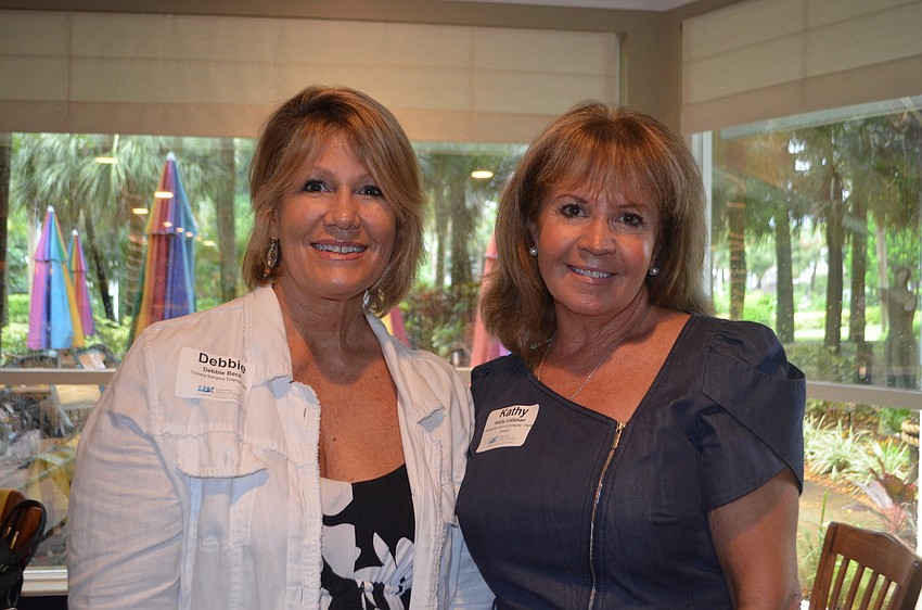 Debby Beck of Tommy Bahama Restaurant and Bar and Kathy Callahan of Michael Saunders and Co.