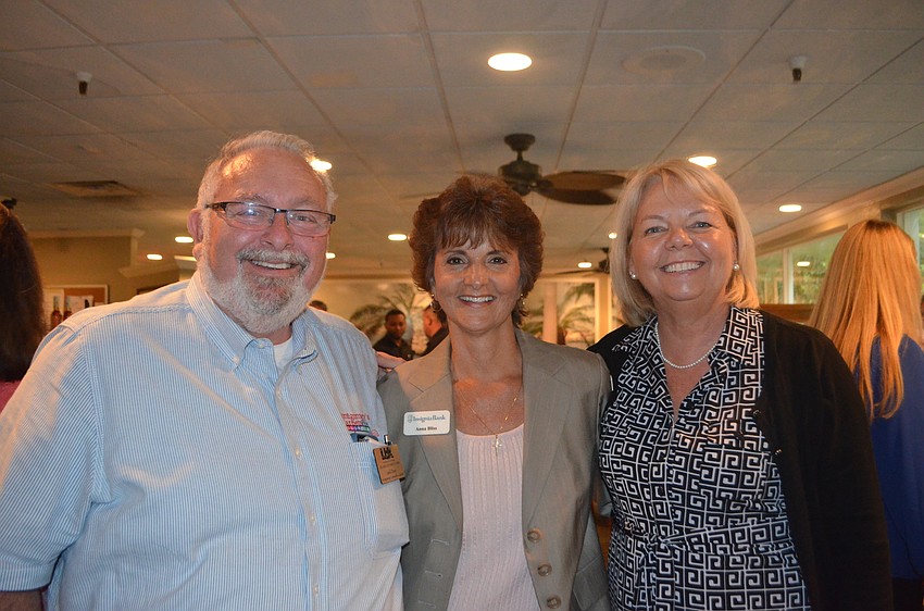 Jack Dean of Montgomery Carpets Plus, Anna Bliss and Tish Scott-Murphy of Insignia Bank