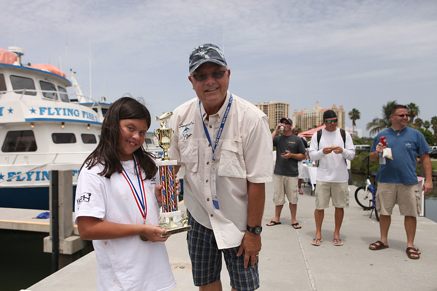 Jaimee Baker won a trophy for catching the most fish, a total of 21 during the Kids Klub Fishing Tournament of the Sarasota Slam.