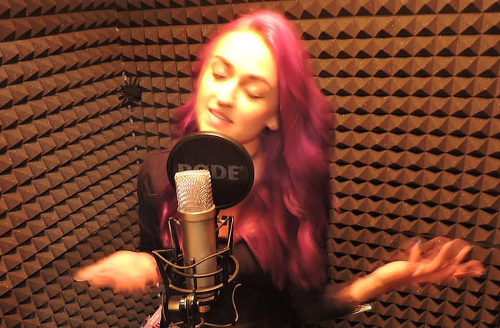 Ilana Armida gets with the flow inside her closet-sized recording studio.