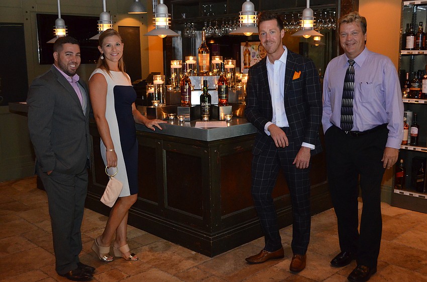 Moet Hennessy Portfolio Specialist Michael Ray, On Premise Senior Sales Consultant Jenna Morgan and Glenmorangie Ambassador Clarke Boyer with Coastal Wine and Spirits Area Manager Doug Singletary.