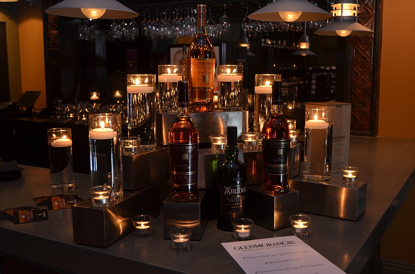 A display featuring candles and Glenmorangie bottles decorated the bar at Michael’s Wine Cellar.