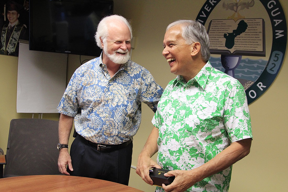 Mote Marine Laboratory President and CEO Dr. Michael P. Crosby and University of Guam President Dr. Robert Underwood. Photo courtesy of Mote.