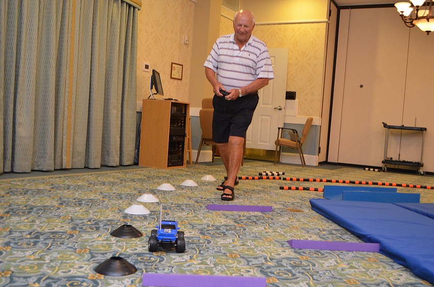 Lee Linquest pilots his car through a series of speed bumps on the course.