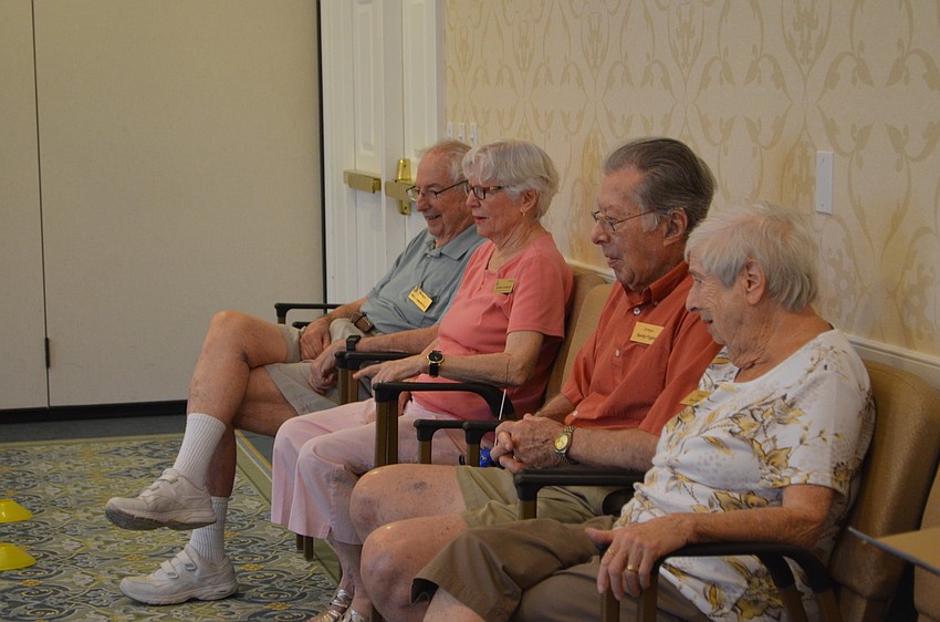 Members stop by during their morning errands to watch the competition.