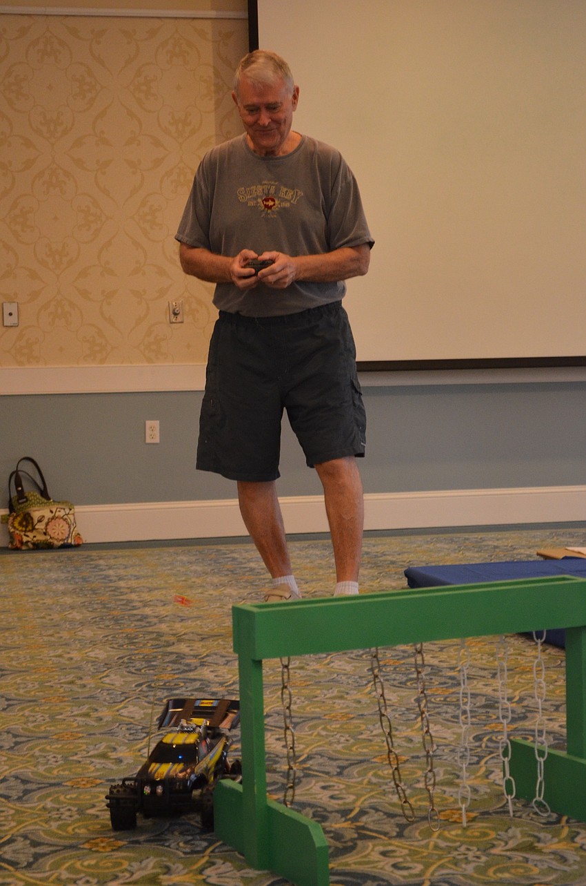 Wally Smith hits the sides of the chain curtain obstacle.