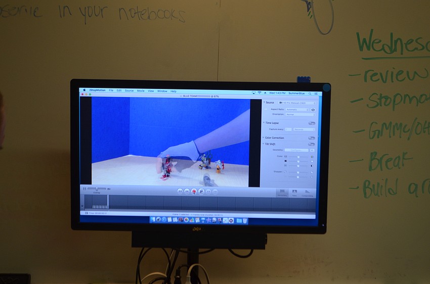 The campers played back the images they took on computer screens.