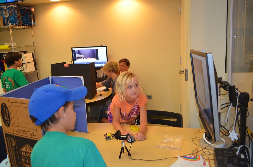 Reef Teffenhart, 8, and Marin Walters, 8, watch their stop motion video.