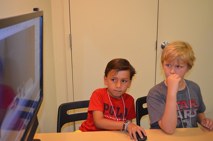 Javier Ramirez, 7, and Ethan Boyes, 9, play their stop motion video.