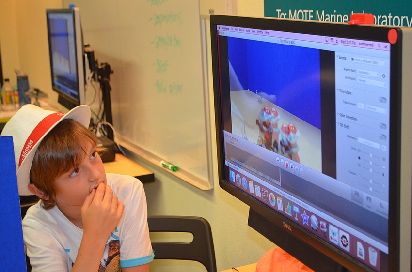 Leonardo Susini, 10, watches the stop motion video he made with this group.