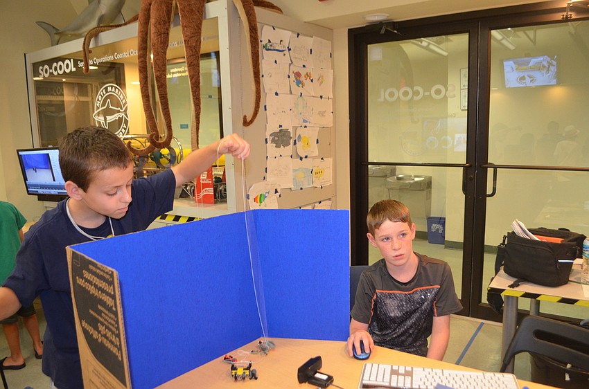 Sebastian Brochu, 10 and Xander Oleksak, 9, work on their stop motion video.