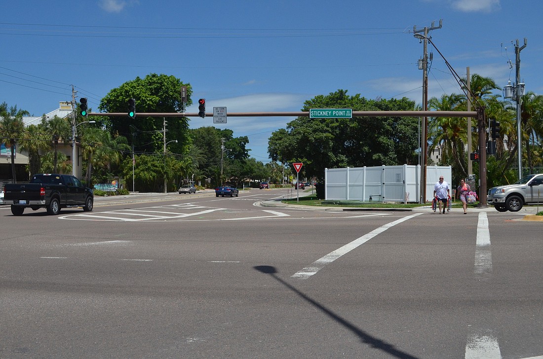 Pedestrians cross Stickney Point Road at the intersection of Midnight Pass Road and Stickney Point Road. FDOT has announced plans to install a pedestrian island on the northeast corner of the intersection and tighten the right turn.